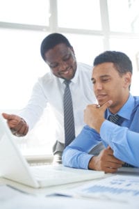 Finding a Mentor African-american businessman presenting his ideas to colleague at meeting 